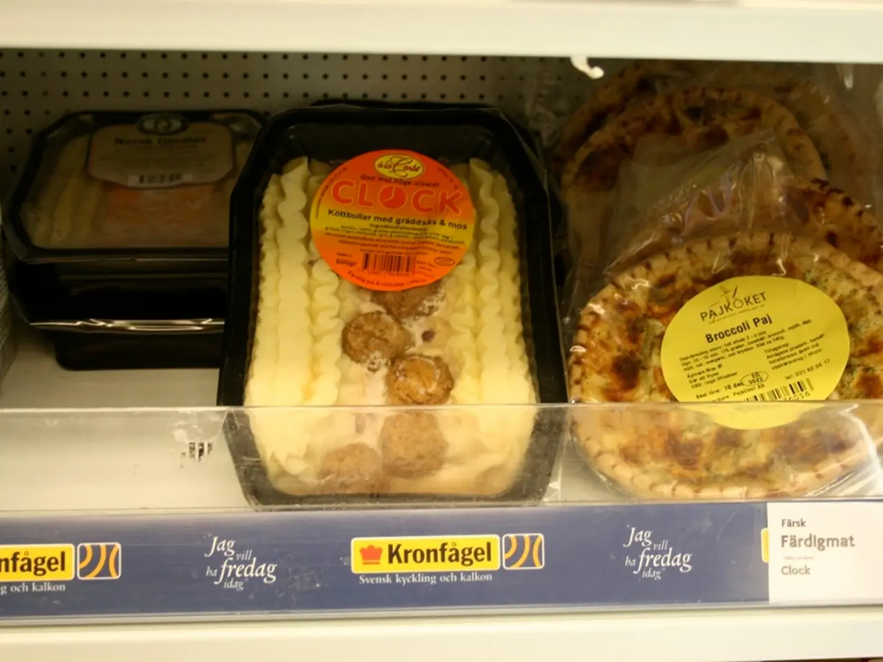 In this picture we can see some eatable item boxes are kept in a shelves.