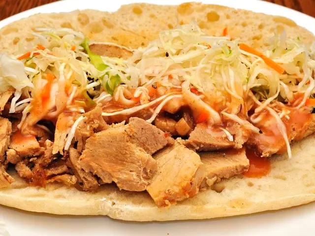 In the center of the image we can see sandwich places on the plate.