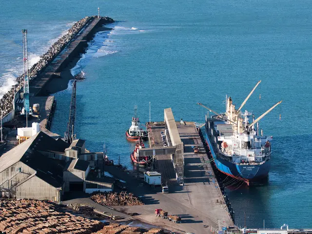 In this image in the front there are objects which are brown in colour and there is a building...