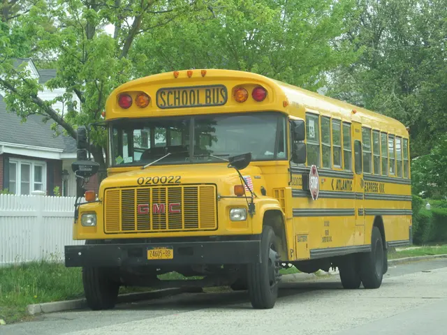 This image consists of a bus in yellow color. At the bottom, there is a road. In the background,...