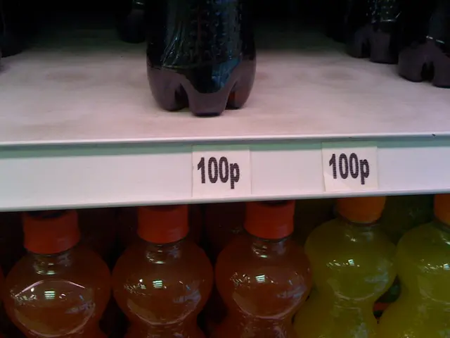 In this image I see bottles, which are of orange, yellow and black in color and they are in racks...