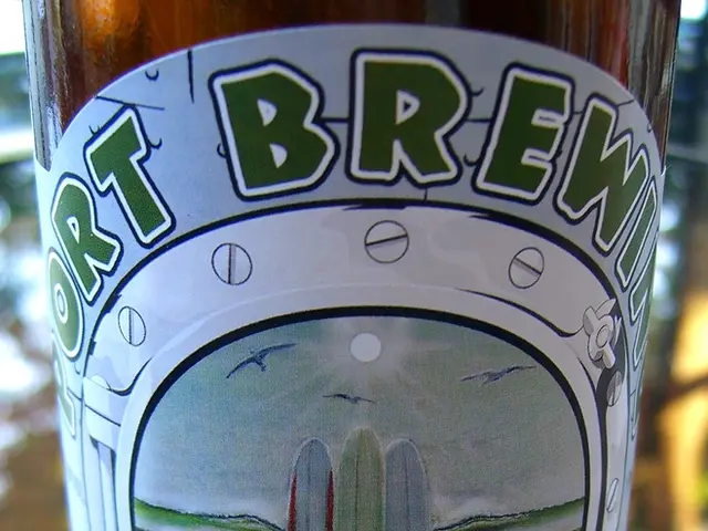 In this image we can see a bottle which is on table is of brand port brewing.